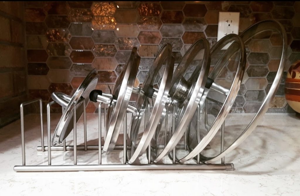 kitchen unpack and storage organization idea pot and pan glass lids Bella Organizing Professional home organizers and residential packing and moving management company serving the San Francisco Bay Area.