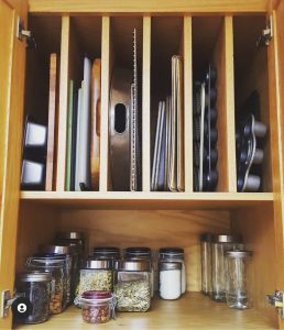 space saving horizontal kitchen storage ideas for cookie and cupcake pans Bella Organizing Professional home organizers and residential packing and moving management company serving the San Francisco Bay Area.
